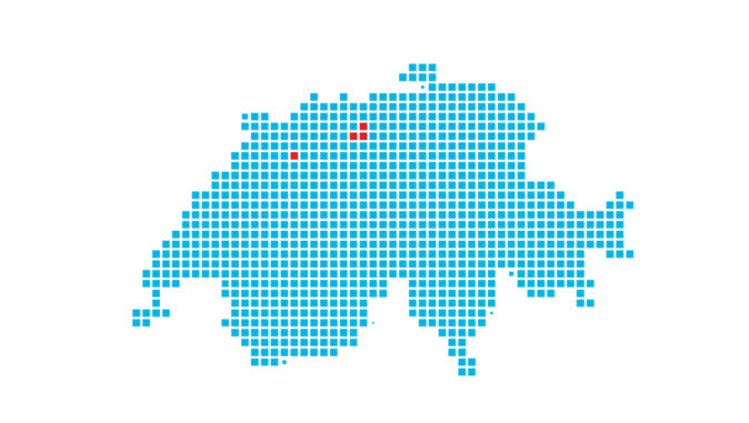Rasterkarte der Schweiz, dargestellt durch blaue Quadrate, mit vier roten Punkten zur Kennzeichnung von Werkstandorten. Die Markierungen befinden sich im nördlichen und mittleren Teil der Schweiz und symbolisieren Unternehmensstandorte oder Produktionsstätten.